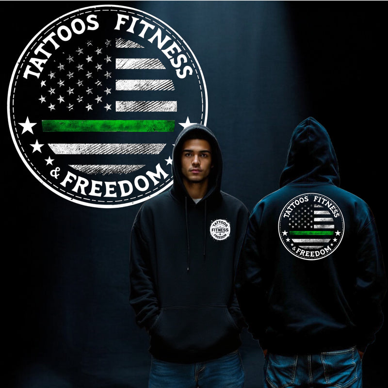 Model wearing a black hoodie featuring a green line, symbolizing the thin green line, with a patriotic design.