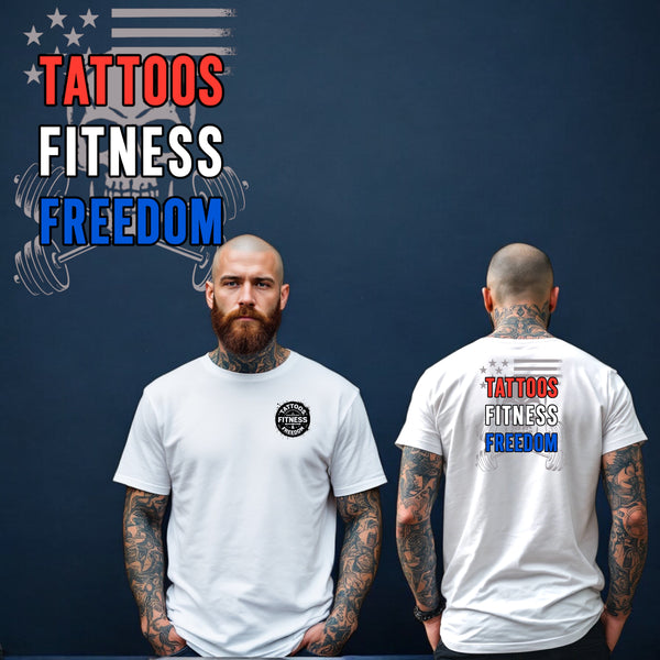 A man wearing a white shirt with 'Tattoos Fitness Freedom' printed on the front and back, showcasing his tattoos.
