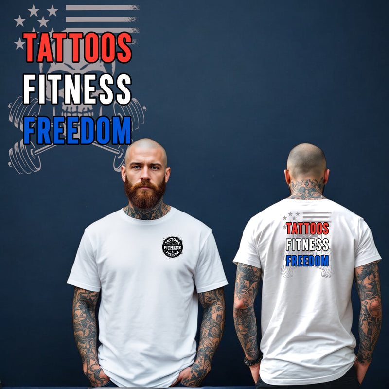 A man wearing a white shirt with 'Tattoos Fitness Freedom' printed on the front and back, showcasing his tattoos.